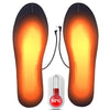 Heated shoe insoles with a temperature gauge showing 50 degrees Celsius on a white background.